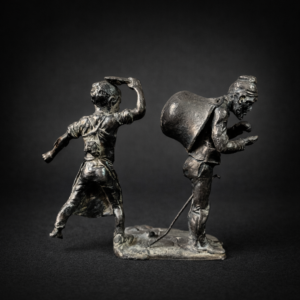Escultura antigua en metal; niño y mendigo contando monedas. Circa 1900.