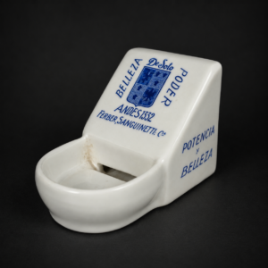 Humectador de dedos publicitario De Soto en porcelana, ca. 1930.