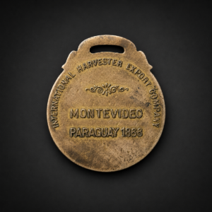 Medalla publicitaria McCormick-Deering, ca. 1930.
